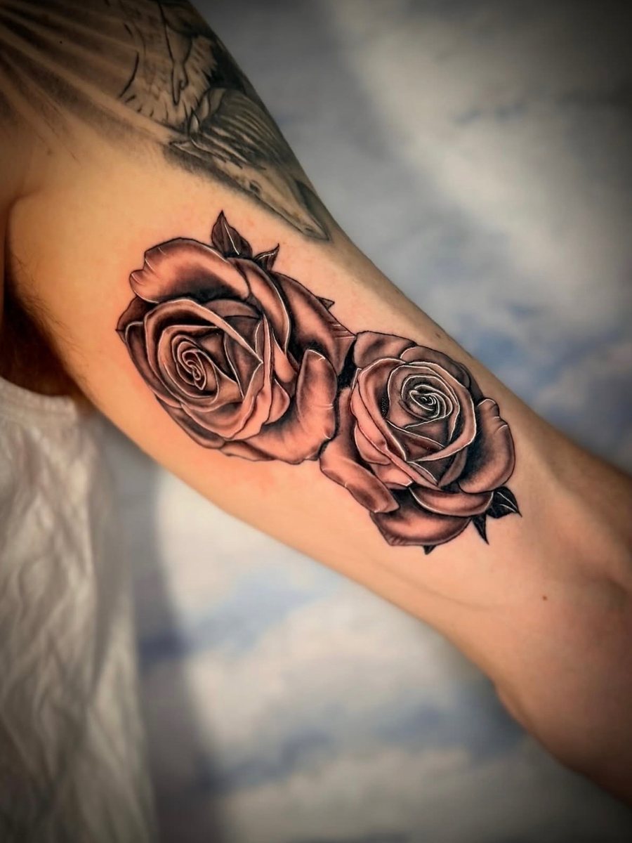 Two black and grey roses on the inner arm, black and grey realism tattoo by Brendon at Diamond Mind Tattoo, Buzzards Bay