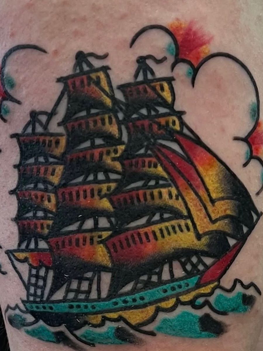 Clipper ship under full sail with clouds and waves on the thigh, American Traditional tattoo by Chris at Diamond Mind Tattoo, Buzzards Bay