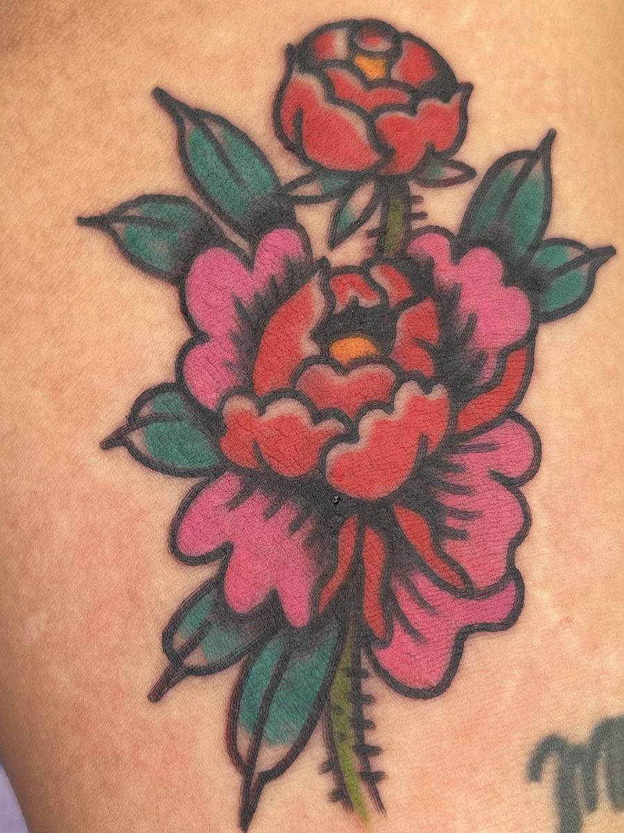 Red and pink peony with a bud and green leaves, American Traditional tattoo by Chris at Diamond Mind Tattoo, Buzzards Bay