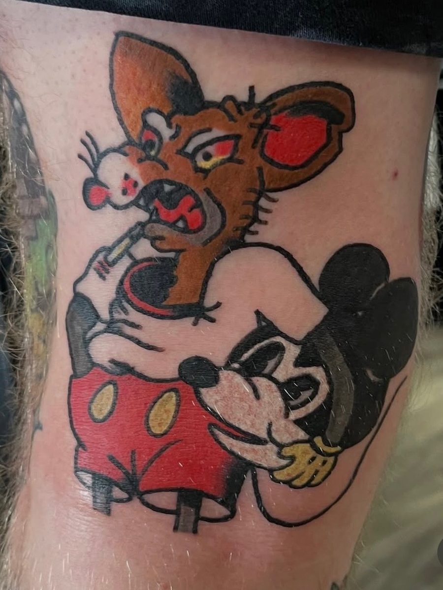 Rat smoking a cigarette above a classic-style cartoon mouse, American Traditional tattoo by Chris at Diamond Mind Tattoo, Buzzards Bay