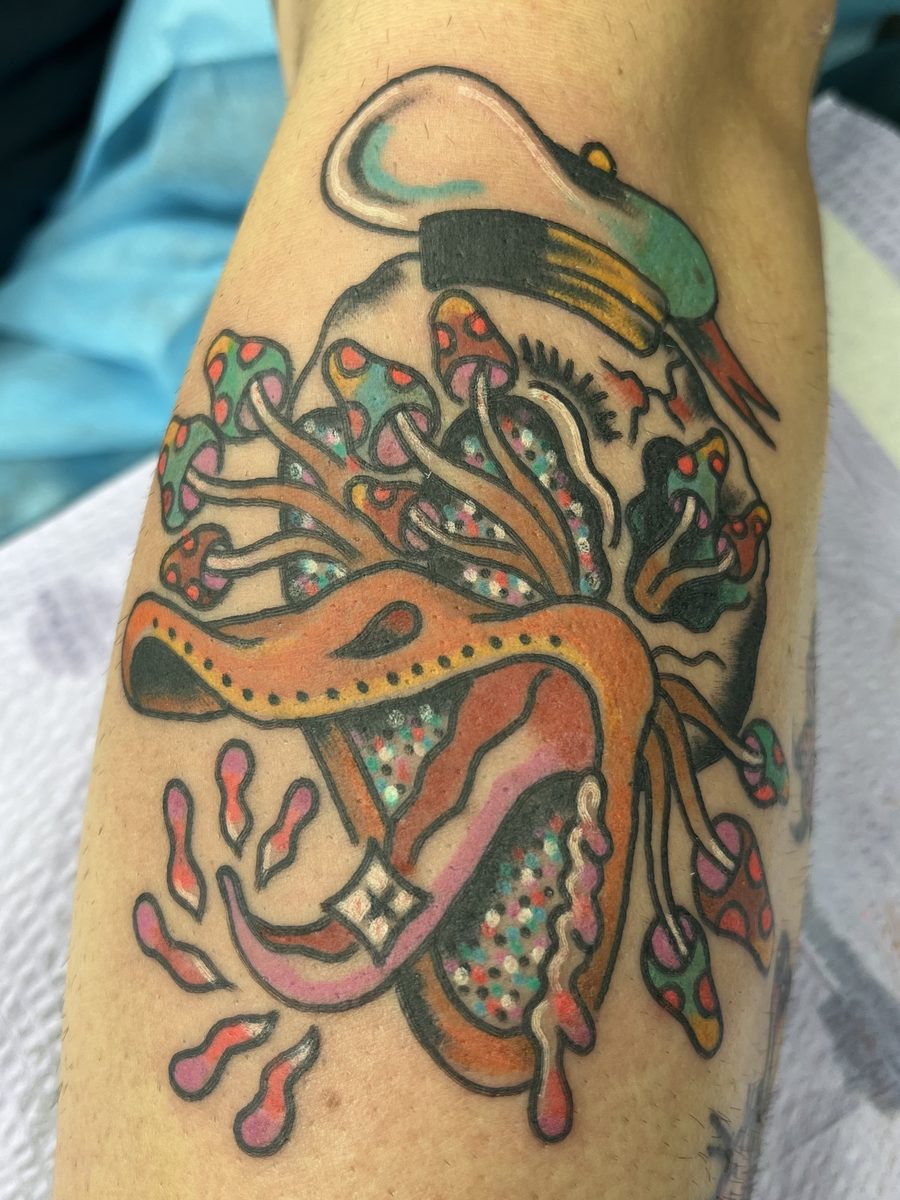 Colorful snake with mushrooms growing from it on the forearm, American Traditional tattoo by Chris at Diamond Mind Tattoo, Buzzards Bay